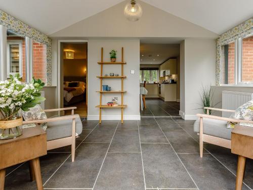 a living room with couches and a table at 1 Bed in Presteigne 78351 in Kinsham