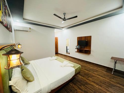 Katil atau katil-katil dalam bilik di Rashiva Resort