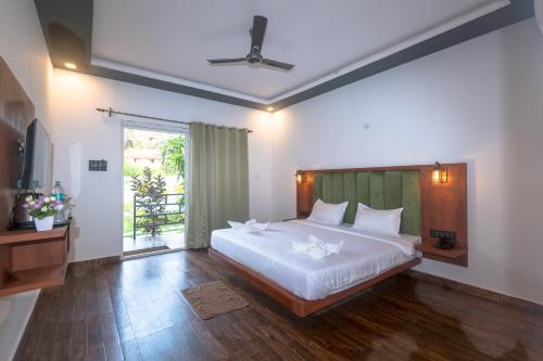 Katil atau katil-katil dalam bilik di Rashiva Resort