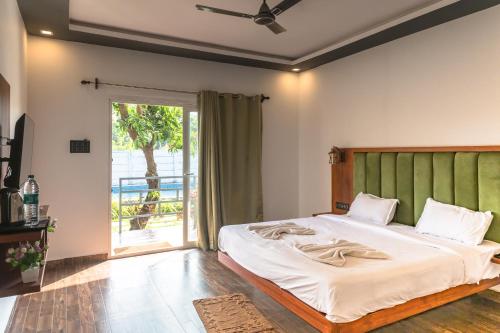 Katil atau katil-katil dalam bilik di Rashiva Resort
