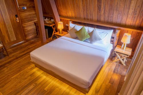 a bedroom with a large white bed in a room at Wilpattu Safari Resort in Wilpattu