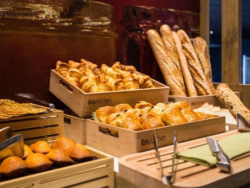 a bakery with several boxes of bread and pastries at ibis Bordeaux Lac in Bordeaux