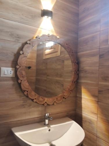a bathroom with a mirror and a sink at sabrina camp in Siwa