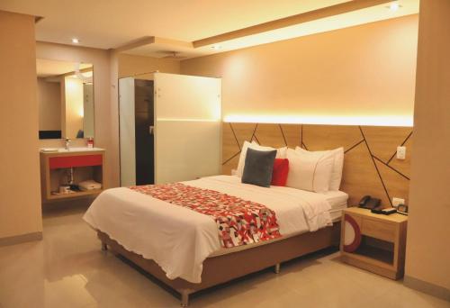 Una cama o camas en una habitación de Obo Hotel