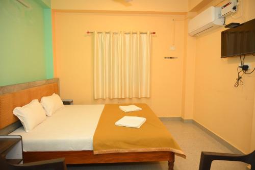 Cama o camas de una habitación en ROYAL SEAVIEW RESIDENCY