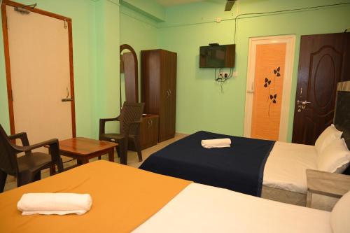 Cama o camas de una habitación en ROYAL SEAVIEW RESIDENCY