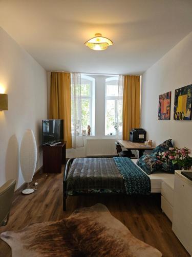 a living room with a bed and a couch at Olymp 6-8 in Bamberg