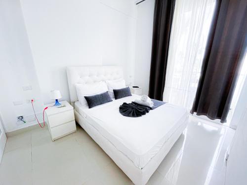 Cama o camas de una habitación en Caribbean WAVE DREAM BEACH Studios HOTEL with WiFi ROOFTOP POOL & SPA