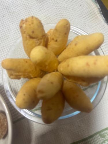 a glass bowl of potatoes on a table at Pousada Recanto do Tucano in Cavalcante