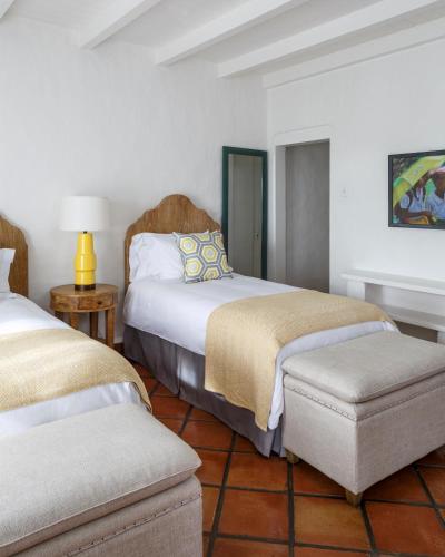 a hotel room with two beds and a chair at Windjammer Landing Resort and Residences in Gros Islet