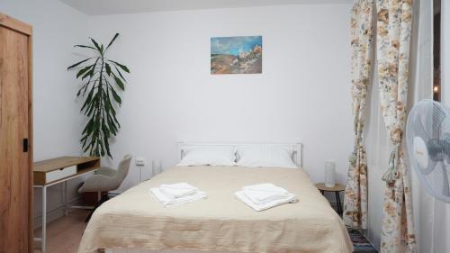 Ένα ή περισσότερα κρεβάτια σε δωμάτιο στο Polus Home