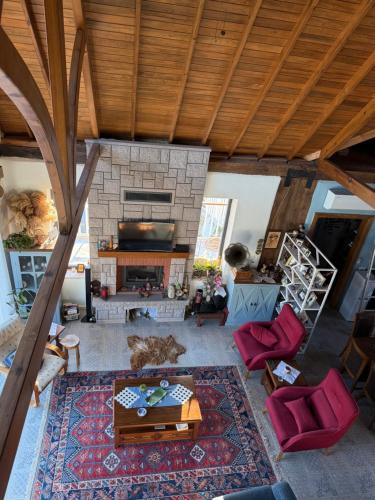 an aerial view of a living room with a fireplace at Saman Evim Çiftliği in Sındırgı