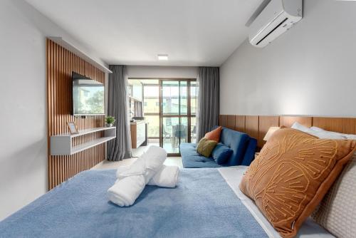 Ένα ή περισσότερα κρεβάτια σε δωμάτιο στο Edf Tangaroa Flats em Porto de Galinhas by BLU stay