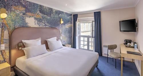 a hotel room with a white bed and a window at Best Western Poitiers Centre Le Grand Hôtel in Poitiers