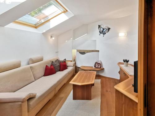 a living room with a couch and a table at Apartment Schmetterling in Collalbo
