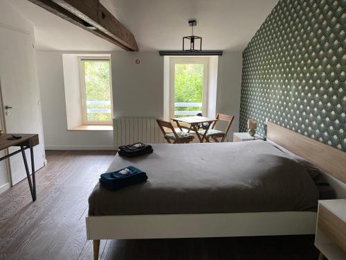 Ένα ή περισσότερα κρεβάτια σε δωμάτιο στο chambre d'hôte Céleste