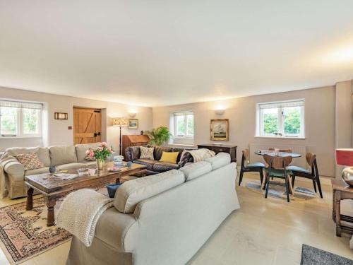 a living room with a couch and a table at 4 Bed in Blandford Forum 76544 in Twyford