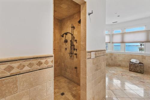 a large bathroom with a shower in a room at Spectacular 8 Bedroom Oceanfront Hamptons Beach House, Your Castle By The Sea ! in Remsenburg