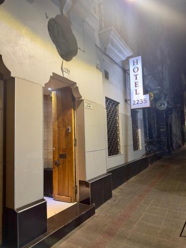 a door in a building with a sign on the wall at Hotel Santiago Yungay in Santiago