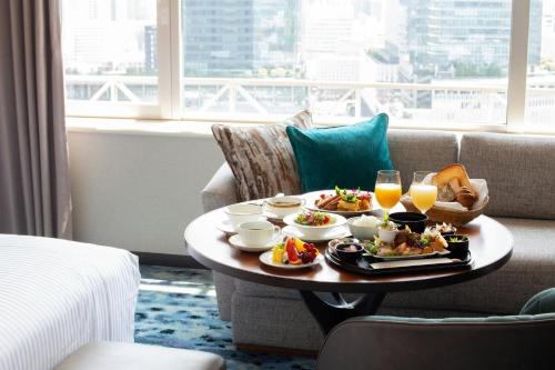 a tray of food on a table in a hotel room at The Westin Osaka in Osaka