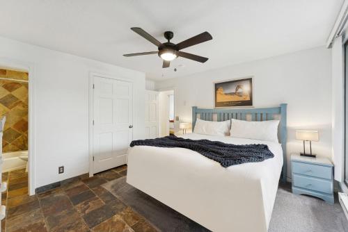 a bedroom with a bed and a ceiling fan at Silvertown Powder Pad-on Park Ave Steps to Slopes Shops and Dining in Park City
