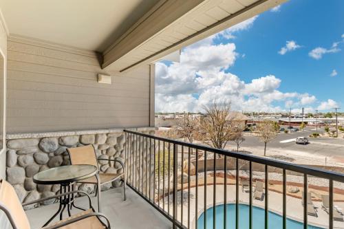 a balcony with a table and chairs and a view at Holiday Inn Express Fallon by IHG in Fallon