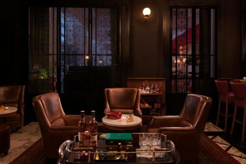 a restaurant with two chairs and a table at Ritz Carlton DIFC Downtown Dubai in Dubai
