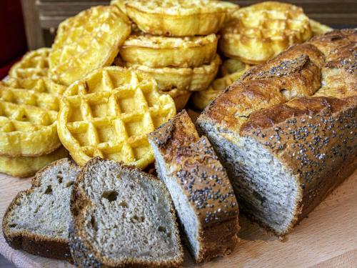 a plate of bread and waffles and bread and waffleergy at Novotel Lille Aéroport in Lesquin