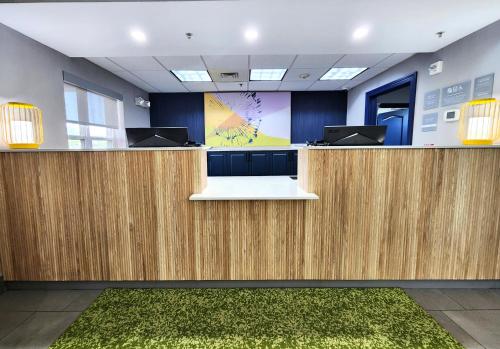 an office cubicle with two desks and a presentation at Spark by Hilton California Lexington Park in California