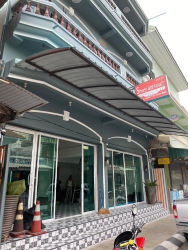 a building with awnings on the side of it at Sherly 888 Hotel in Hua Hin