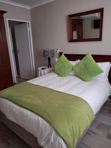 Ένα ή περισσότερα κρεβάτια σε δωμάτιο στο Melkbosstrand Bed and Breakfast
