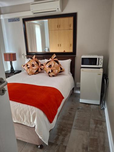 Ένα ή περισσότερα κρεβάτια σε δωμάτιο στο Melkbosstrand Bed and Breakfast