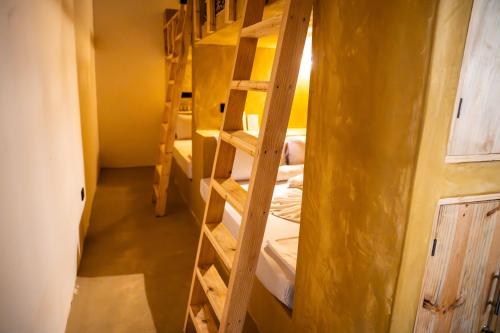 a room with several bunk beds in a building at Hostel 197 in Nungwi
