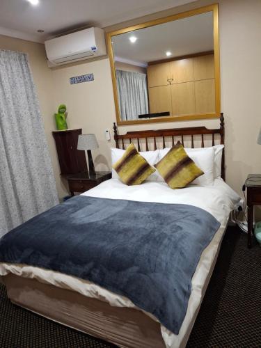 Ένα ή περισσότερα κρεβάτια σε δωμάτιο στο Melkbosstrand Bed and Breakfast