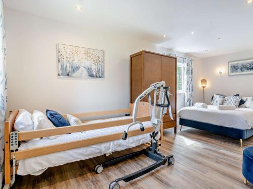 a hospital room with two beds and a stretcher at 2 Bed in Gower 91728 in Killay