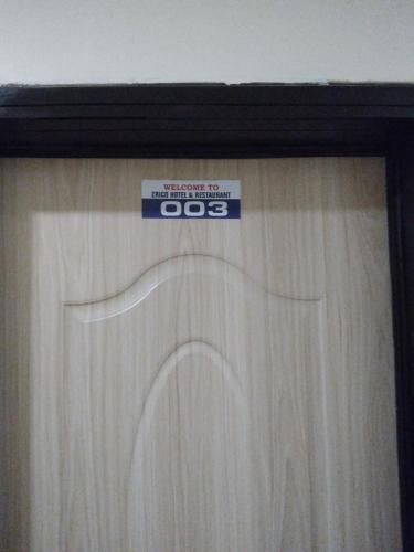 a sign on top of a window with a curtain at Zrico Hotels and Restaurant in Oke-Aro