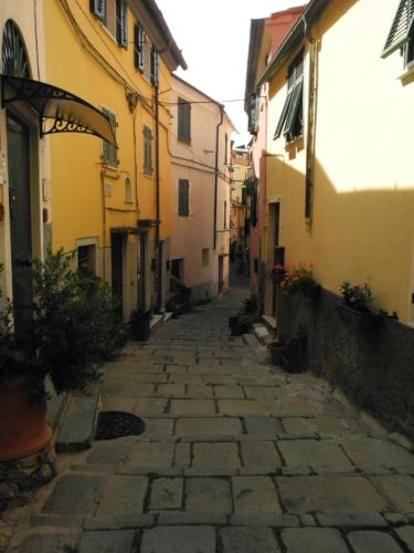 an alley in an old town with buildings at La Spezia Marola Un Borgo Sul Mare in La Spezia