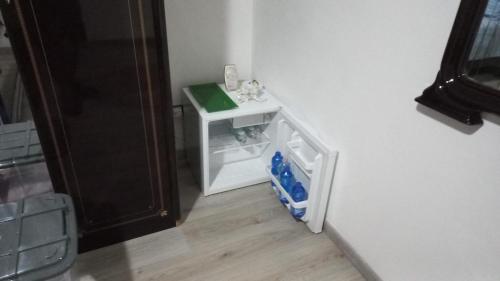 a toy kitchen with a small refrigerator in a room at Casa Relax - Relax Holiday in Valledolmo