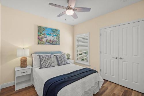 a bedroom with a bed and a ceiling fan at Datura Dreams in Southgate