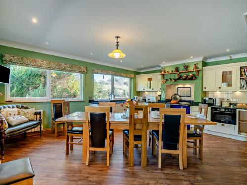 a kitchen and dining room with a table and chairs at 5 Bed in Newton-in-Cartmel 95876 in High Newton
