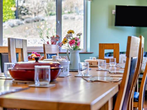 a wooden table with glasses and a bowl on it at 5 Bed in Newton-in-Cartmel 95876 in High Newton
