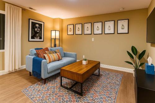 a living room with a blue couch and a coffee table at Homey 1BR APT in SSFO with Washer Dryer WiFi in Westborough