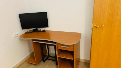 a desk with a computer monitor on top of it at Superb flat in the centre of capital, ski, Caldea in Andorra la Vella
