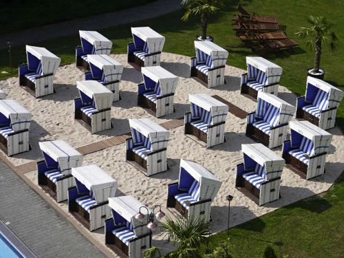 an overhead view of blue and white lounge chairs at Mercure Hotel Frankfurt Eschborn Ost in Eschborn