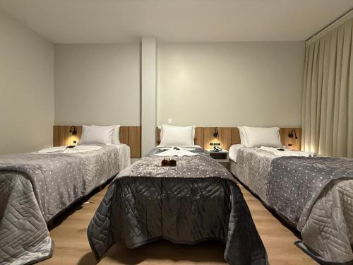 Postel nebo postele na pokoji v ubytování Hotel Bon Vivant