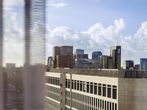 a view of a city skyline from a building at Novotel Amsterdam City in Amsterdam