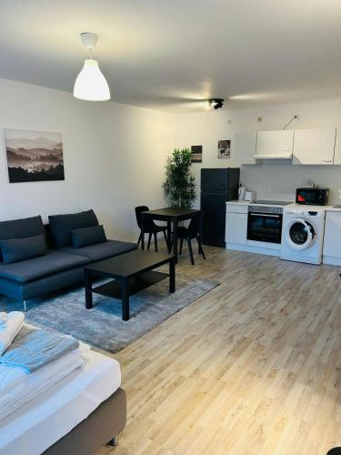 a living room with a couch and a table at Studio mit 2 Einzelbetten, Bad Kleinen in Bad Kleinen
