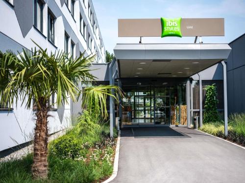 a building with the front entrance to a hotel at Ibis Styles Linz in Linz