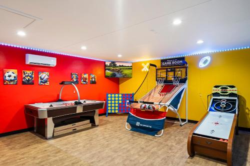 a childrens room with a play area with a slide at Northstar Zen Resort- Rock Waterslide - Pool - Spa - Secret Tunnel - Epic Game Room in Glendale