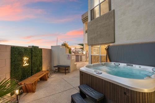 a hot tub on the balcony of a building at Northstar Zen Resort- Rock Waterslide - Pool - Spa - Secret Tunnel - Epic Game Room in Glendale